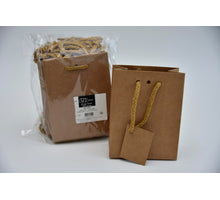 eine 20-Tasche braune Kraft mit Schnur 11,4 + 6,4 x 14,6 cm.